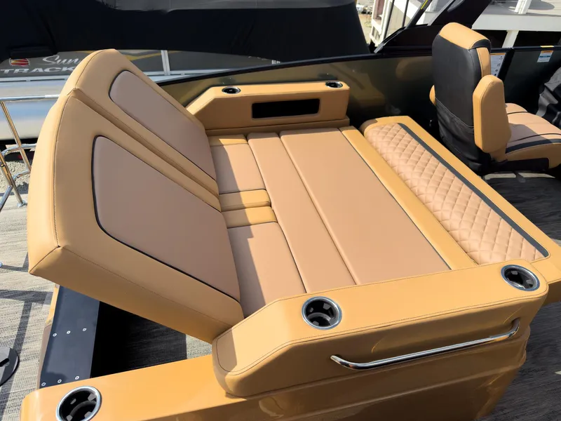 Slide: The Image of 2026 Godfrey AquaPatio 23' Flip Lounge Tritoon on trailer, sleek design under cloudy sky. - 34