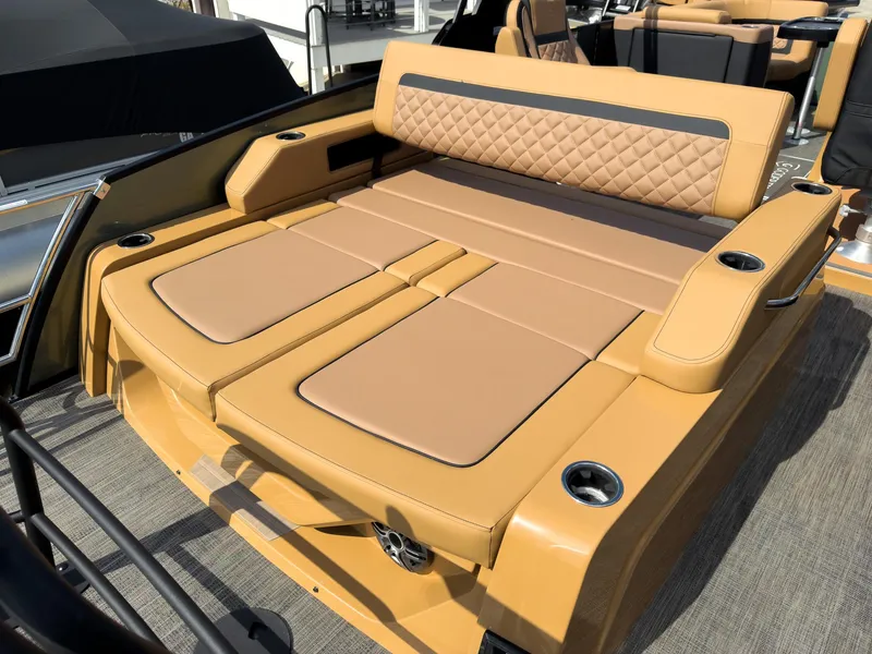 Slide: The Image of Luxurious seating on 2026 Godfrey AquaPatio 23' Flip Lounge Tritoon boat, featuring tan upholstery. - 37