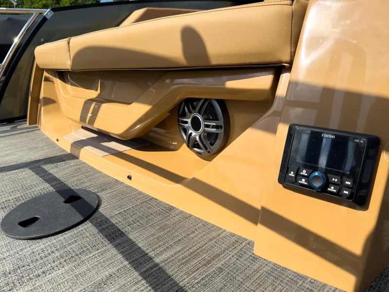 Slide: The Image of 2026 Godfrey AquaPatio 23' Flip Lounge Tritoon with luxurious seating and canopy, parked outdoors. - 41