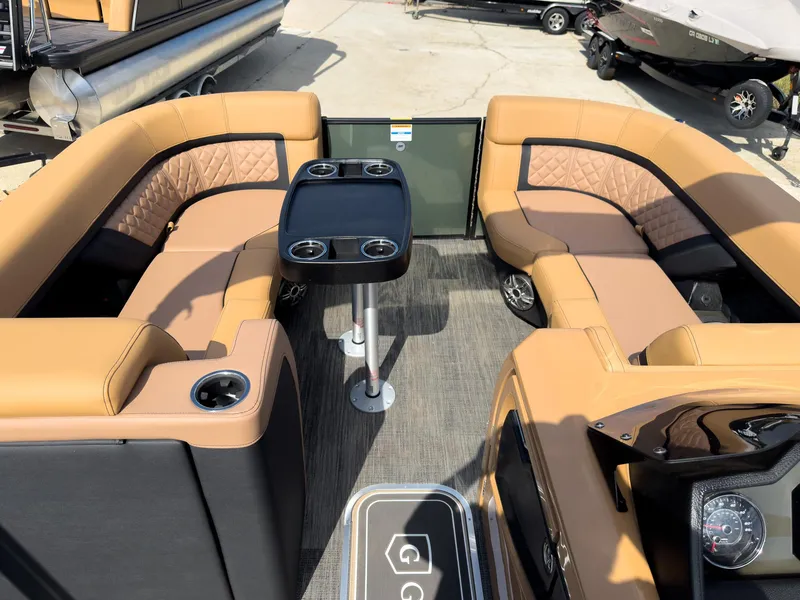 Slide: The Image of Captain's chair and steering wheel on 2026 Godfrey AquaPatio 23' Flip Lounge Tritoon. - 45