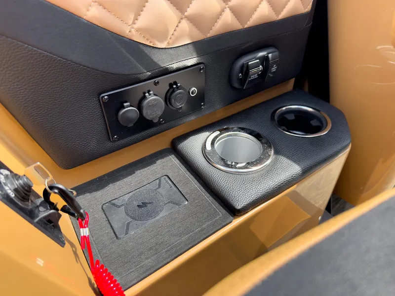 Slide: The Image of Interior of 2026 Godfrey AquaPatio Tritoon with cup holder and control panel. - 50