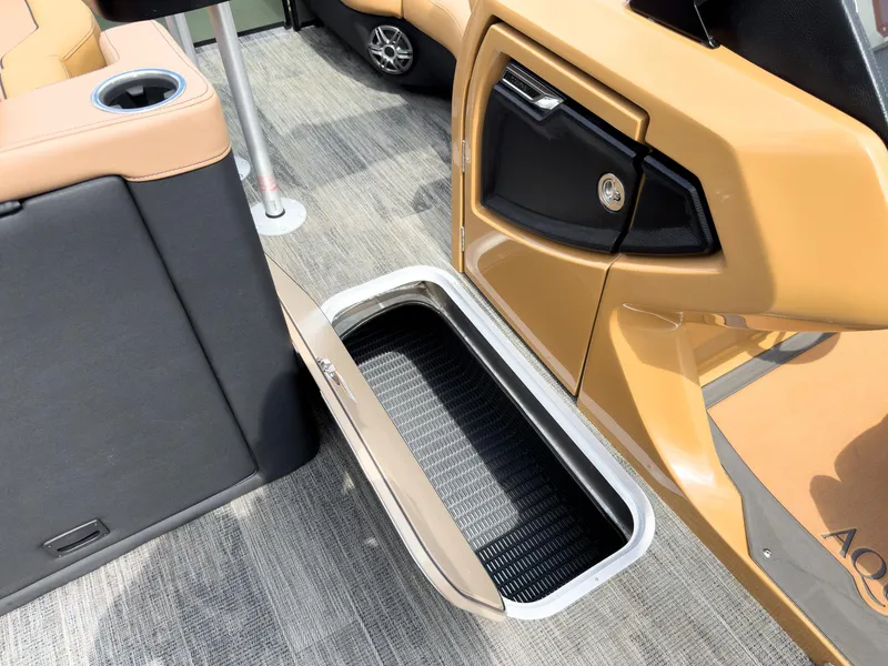 Slide: The Image of Open storage compartment on 2026 Godfrey AquaPatio 23' Flip Lounge Tritoon boat interior. - 55