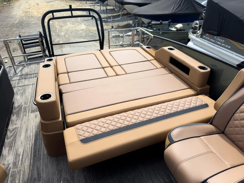 Slide: The Image of 2026 Godfrey AquaPatio 23' Flip Lounge Tritoon with luxurious tan seating and cup holders. - 60