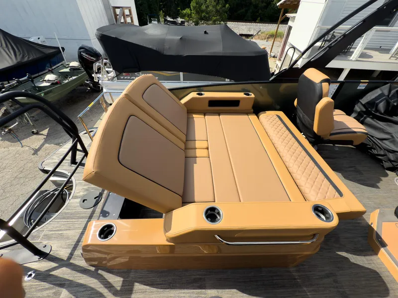 Slide: The Image of 2026 Godfrey AquaPatio 23' Flip Lounge Tritoon with tan seating and cup holders. - 63
