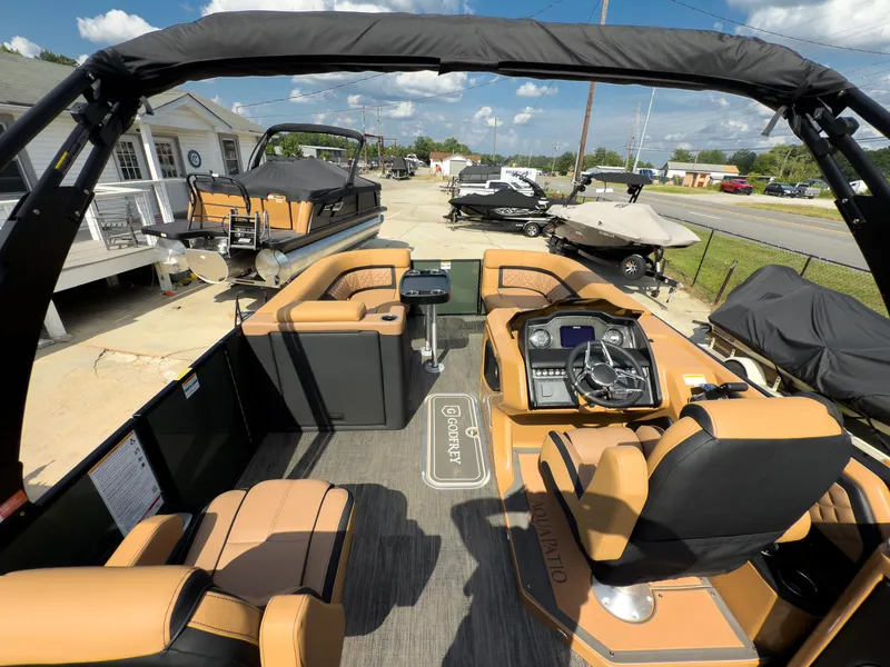 Slide: The Image of 2026 Godfrey AquaPatio 23' Flip Lounge Tritoon with luxurious seating and modern dashboard. - 74