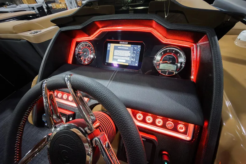 Slide: The Image of 2026 Godfrey Aquapatio 235 ULC dashboard with illuminated controls and modern steering wheel. - 13