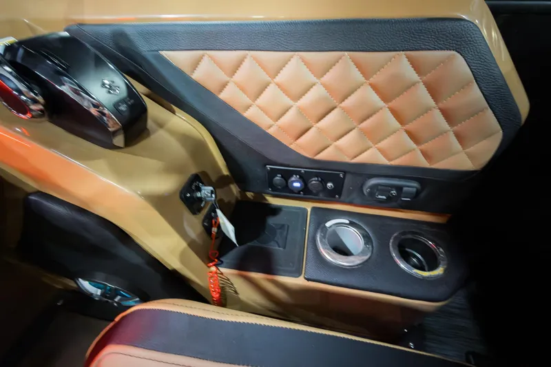 Slide: The Image of Interior of 2026 Godfrey Aquapatio Tritoon, featuring luxurious quilted leather and control panel. - 14