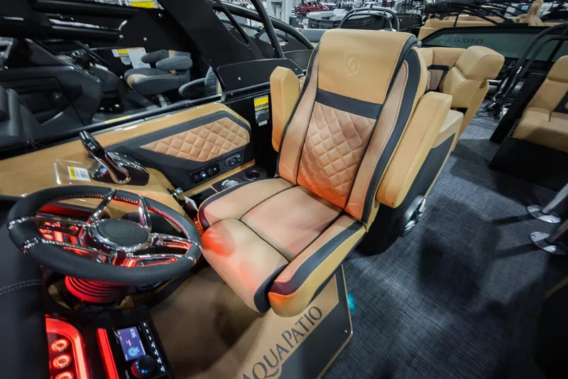 Slide: The Image of Luxurious interior of 2026 Godfrey Aquapatio 235 ULC Tritoon with plush seating and modern controls. - 15