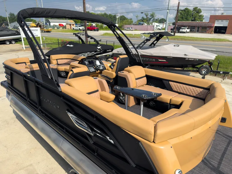 Slide: The Image of 2026 Godfrey Aquapatio 235 ULC Tritoon boat with ultra lounge seating and motor. - 21