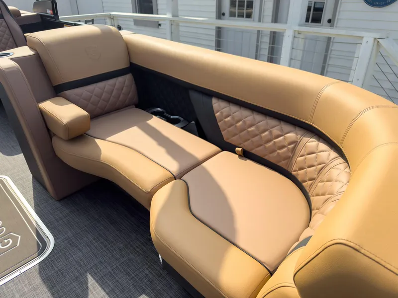 Slide: The Image of 2026 Godfrey Aquapatio Tritoon with Suzuki engine and swim ladder, showcasing luxury and functionality. - 27