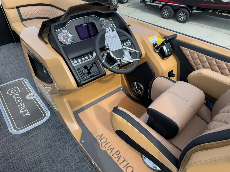 Slide: The Image of Luxurious tan seating on 2026 Godfrey Aquapatio 235 ULC Tritoon boat. - 38
