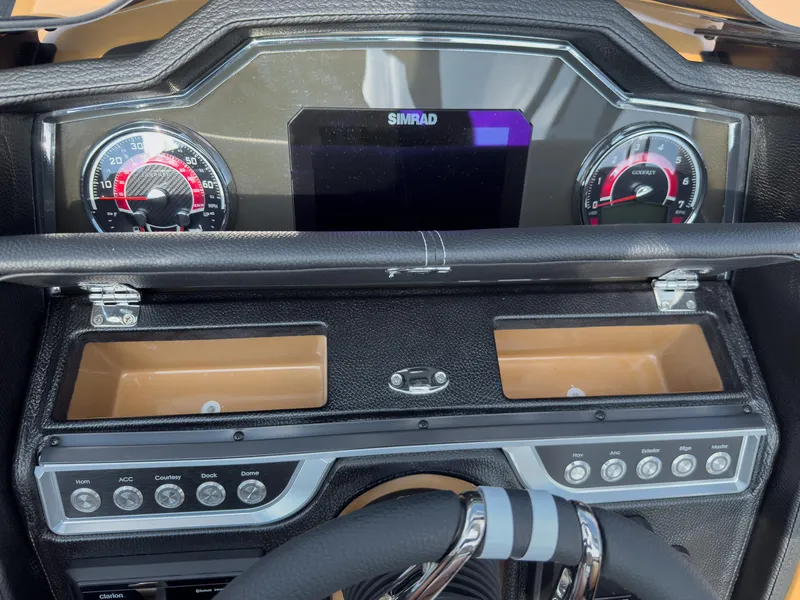 Slide: The Image of Luxurious tan and black seating with cup holder in 2026 Godfrey Aquapatio Tritoon. - 40