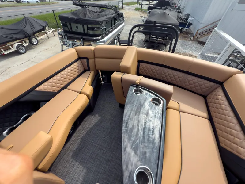 Slide: The Image of Luxurious captain's chair on 2026 Godfrey Aquapatio 235 ULC Tritoon boat, featuring elegant design. - 48