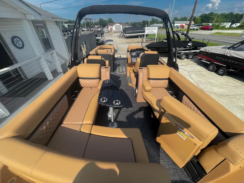 Slide: The Image of Cup holders and seating in 2026 Godfrey Aquapatio 235 ULC Tritoon boat interior. - 55