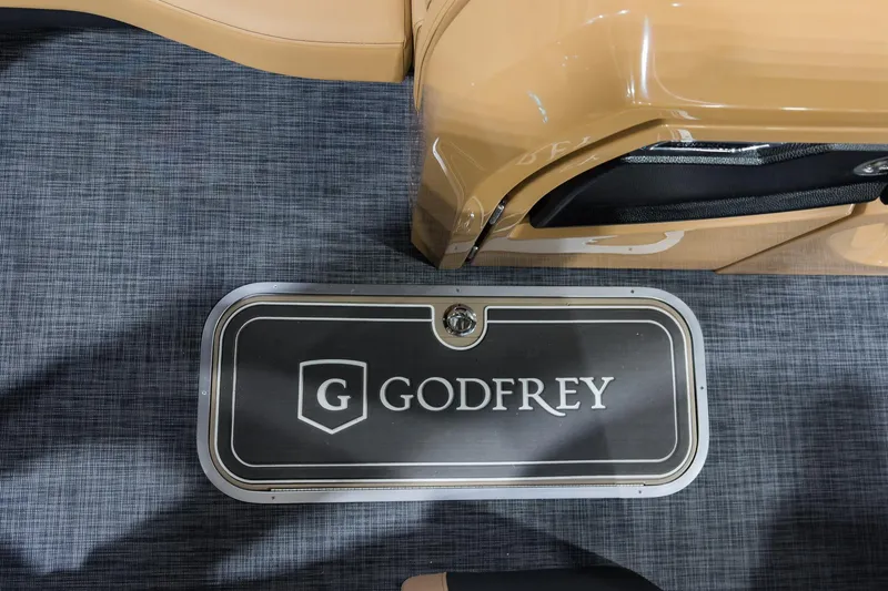 Slide: The Image of 2026 Godfrey Aquapatio 235 ULC Tritoon interior with branded flooring detail. - 8