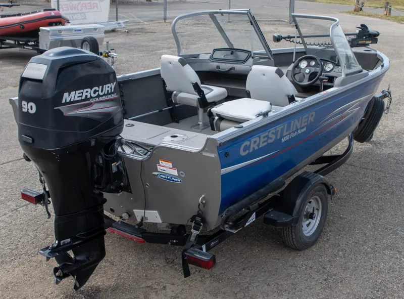 Slide: The Image of 2013 Crestliner 1650 Fish Hawk boat with Mercury 90 outboard motor on trailer. - 10