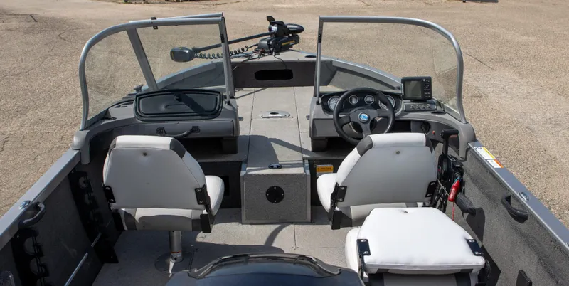 Slide: The Image of 2013 Crestliner 1650 Fish Hawk interior with steering console and seating. - 8