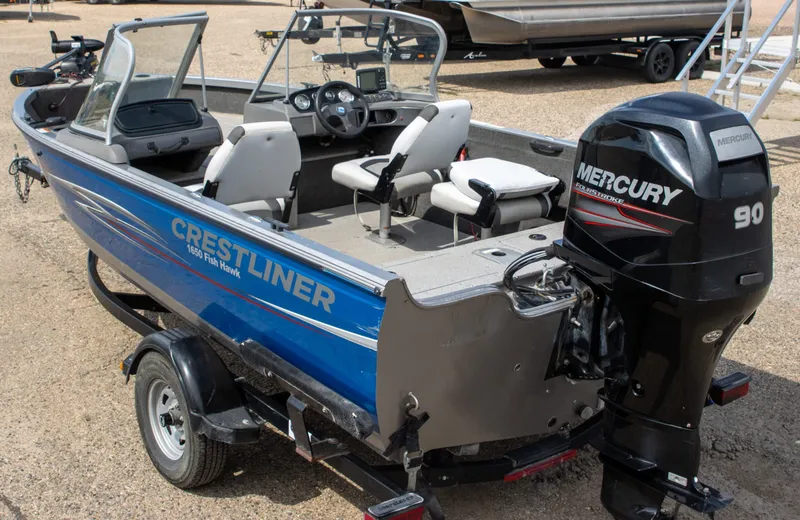 Slide: The Image of 2013 Crestliner 1650 Fish Hawk boat with Mercury 90 engine, parked on a trailer. - 9