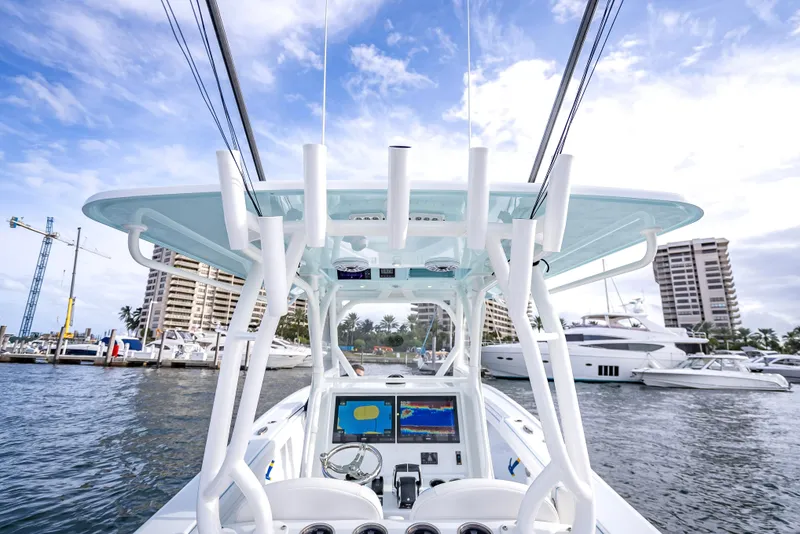 Slide: The Image of 2023 Yellowfin 36 boat at marina, featuring advanced navigation systems and sleek design. - 22