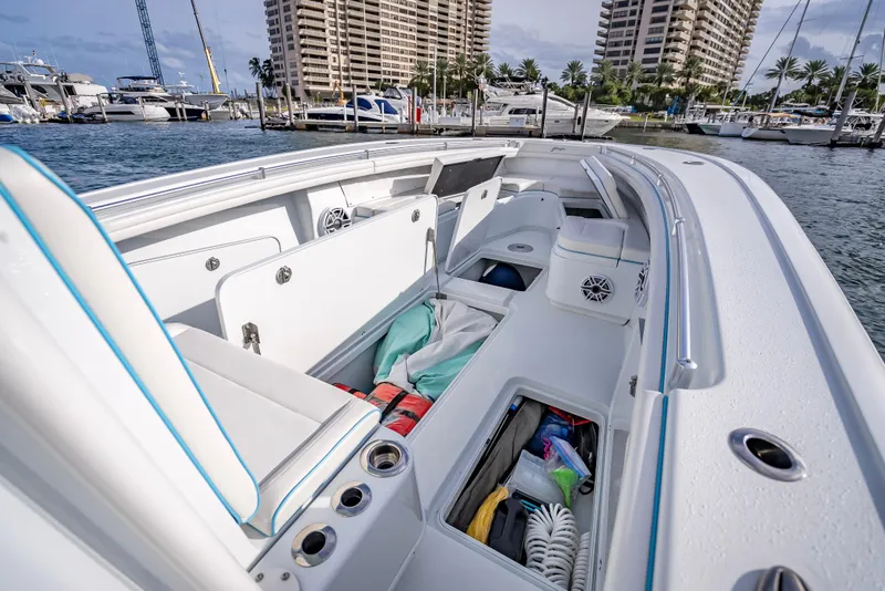 Slide: The Image of 2023 Yellowfin 36 boat interior with open storage compartments at marina. - 37