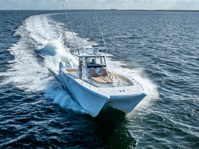 Slide: The Image of 2025 Freeman 35 boat cruising swiftly on open ocean waters. - 11