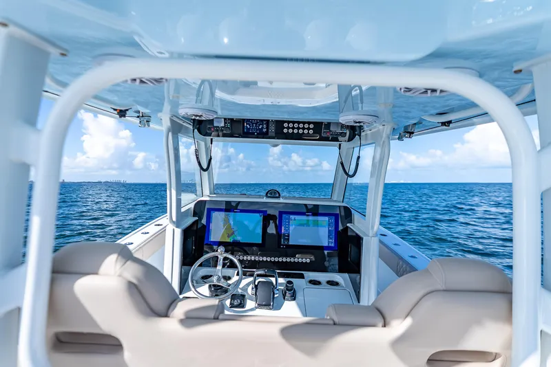 Slide: The Image of Interior view of 2025 Freeman 35 boat cockpit with ocean backdrop. - 17
