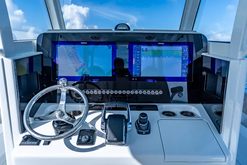 Slide: The Image of Helm of 2025 Freeman 35 boat with dual navigation screens and modern controls. - 20