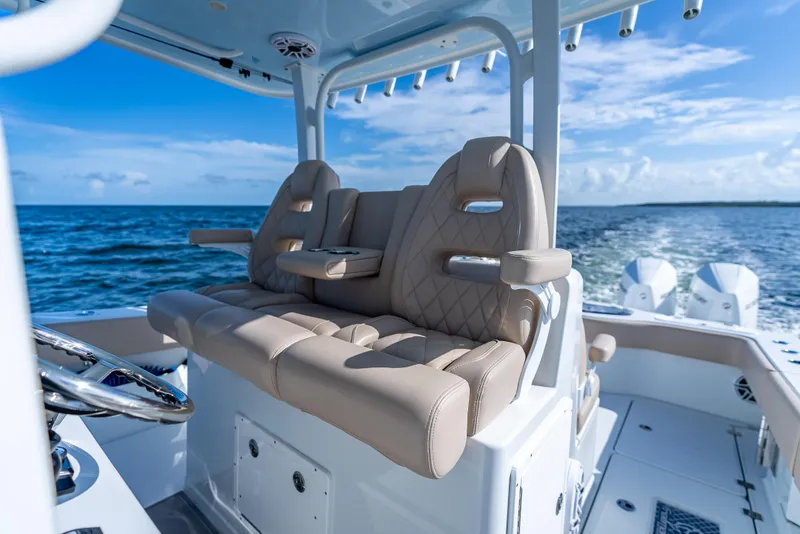 Slide: The Image of Luxurious seating on a 2025 Freeman 35 boat cruising on open water. - 27