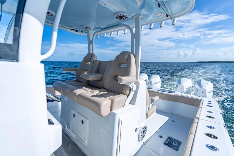 Slide: The Image of Luxurious 2025 Freeman 35 boat interior with plush seating on open water. - 28