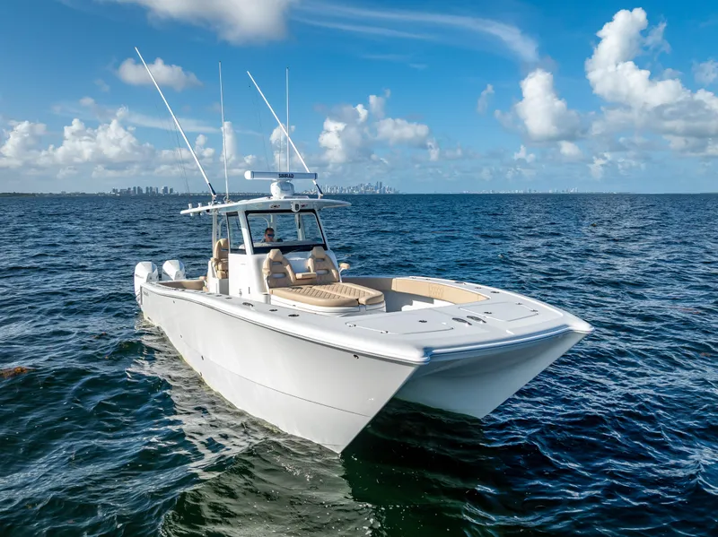 Slide: The Image of 2025 Freeman 35 boat cruising on open ocean under clear blue sky. - 3