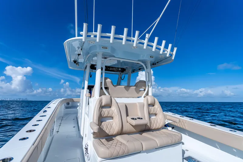 Slide: The Image of Freeman 35 boat, 2025 model, with luxurious seating on open ocean under clear blue sky. - 30