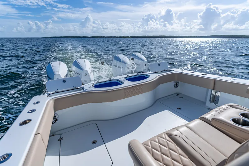 Slide: The Image of Freeman 35 boat cruising on open water, showcasing luxurious seating and powerful engines. - 34