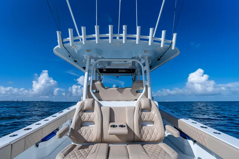Slide: The Image of Luxury Freeman 35 boat interior, 2025 model, on open ocean under clear blue sky. - 35
