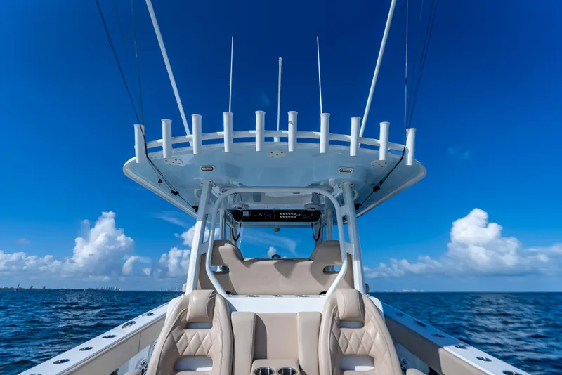 Slide: The Image of 2025 Freeman 35 boat on open sea under clear blue sky. - 36