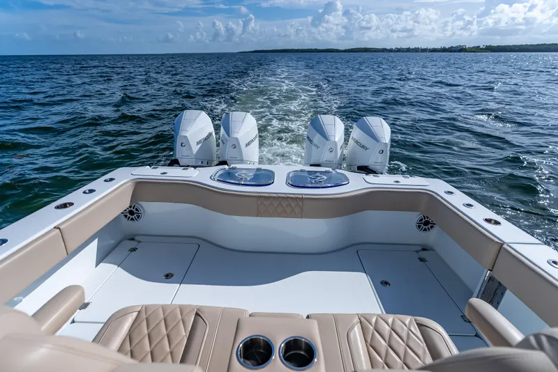 Slide: The Image of Freeman 35 boat, 2025 model, with four Mercury engines cruising on open water. - 38