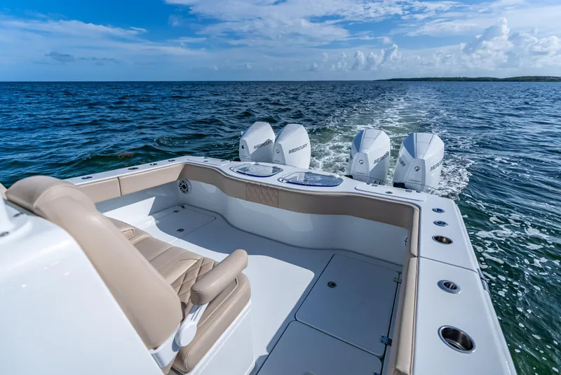 Slide: The Image of 2025 Freeman 35 boat with triple Mercury engines cruising on open water. - 39