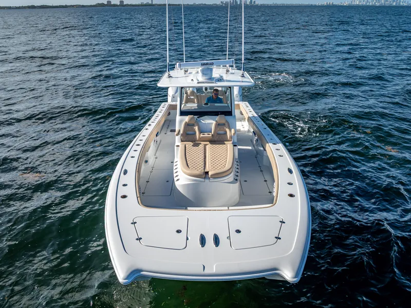 Slide: The Image of 2025 Freeman 35 boat cruising on open water, showcasing sleek design and luxury seating. - 4