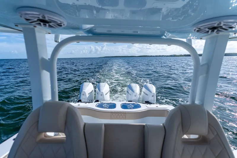 Slide: The Image of Freeman 35 boat with quad Mercury engines cruising on open water, 2025 model. - 40