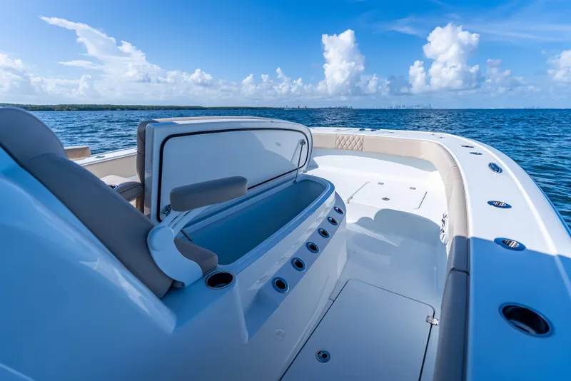 Slide: The Image of Luxurious Freeman 35 boat interior, 2025 model, cruising on open blue sea under clear skies. - 44