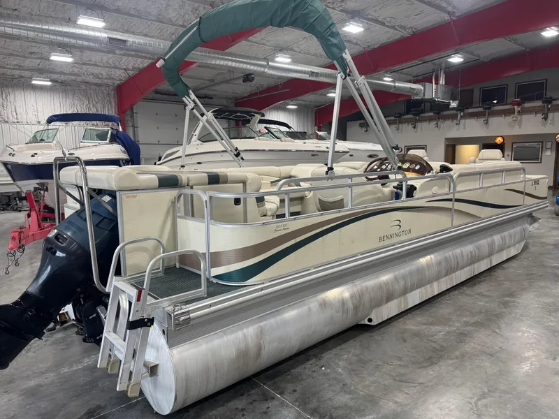 Slide: The Image of 2004 Bennington 2575 pontoon boat in indoor storage facility. - 4