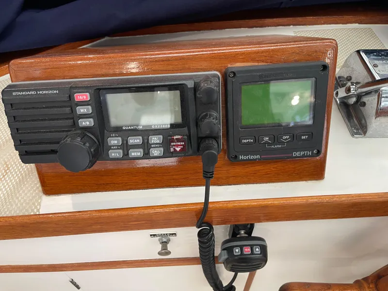 Slide: The Image of 1969 Grand Banks 36 Classic boat radio and depth finder on wooden dashboard. - 19