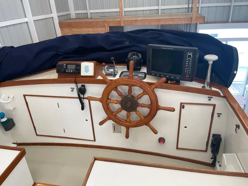 Slide: The Image of Helm of 1969 Grand Banks 36 Classic with wooden wheel and navigation equipment. - 20