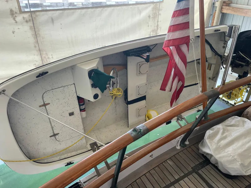 Slide: The Image of 1969 Grand Banks 36 Classic boat interior with American flag and nautical equipment. - 23