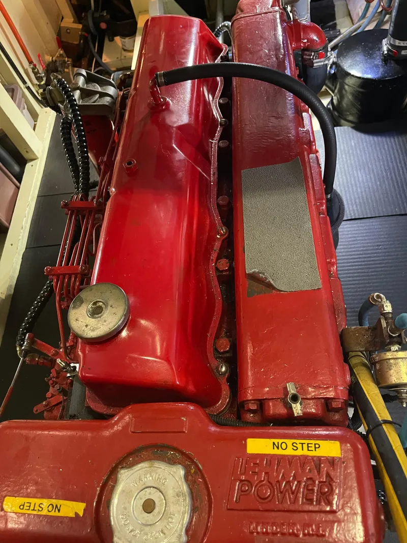 Slide: The Image of Red Lehman engine in a 1969 Grand Banks 36 Classic boat, labeled "NO STEP." - 29