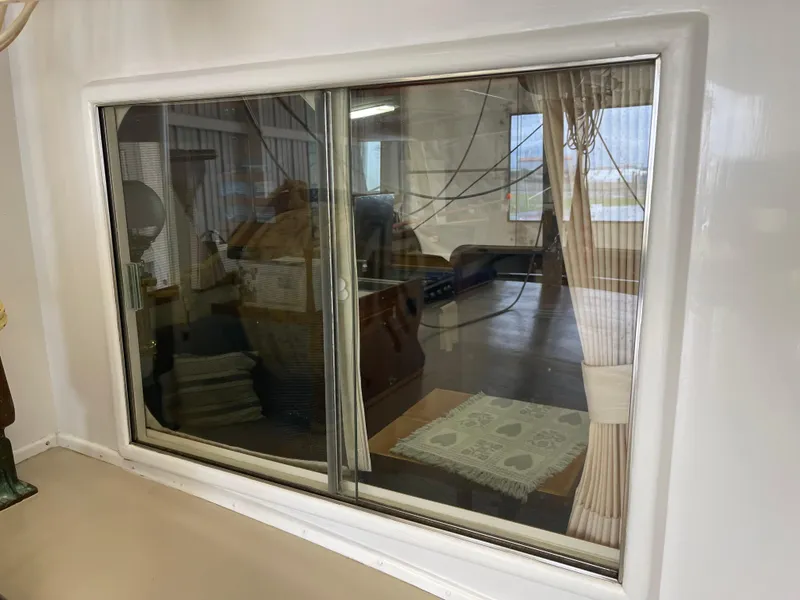 Slide: The Image of Window view inside a 1969 Grand Banks 36 Classic boat, showcasing interior details. - 3