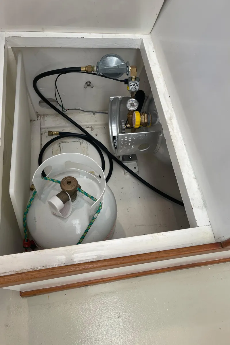 Slide: The Image of Propane tank storage in 1969 Grand Banks 36 Classic boat compartment. - 31