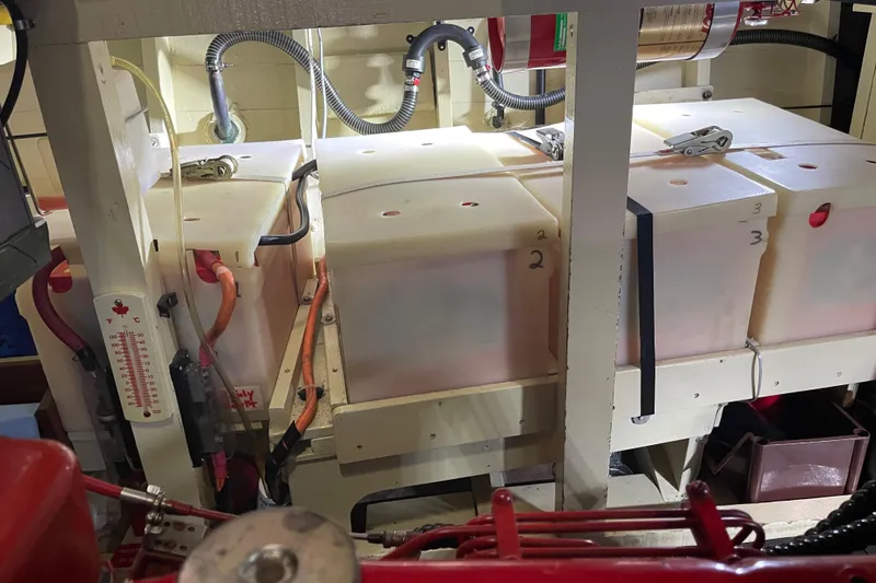 Slide: The Image of Engine room of 1969 Grand Banks 36 Classic with fuel tanks and wiring. - 36