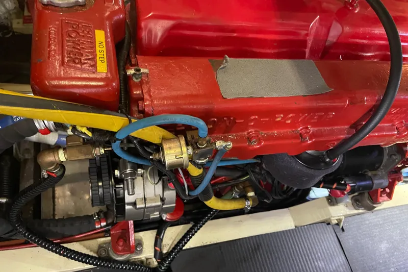 Slide: The Image of Engine of a 1969 Grand Banks 36 Classic boat, featuring red components and visible wiring. - 38