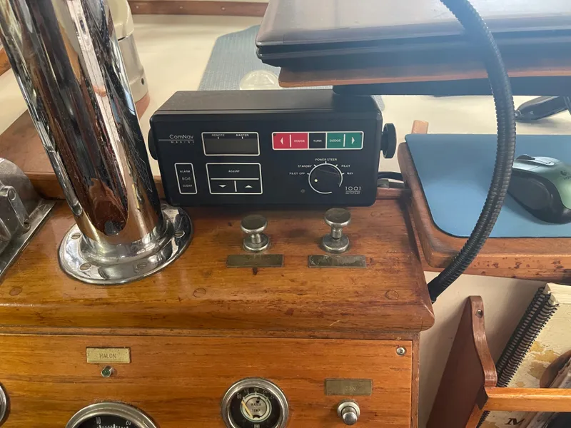 Slide: The Image of Control panel on a 1969 Grand Banks 36 Classic boat, featuring navigation equipment. - 43