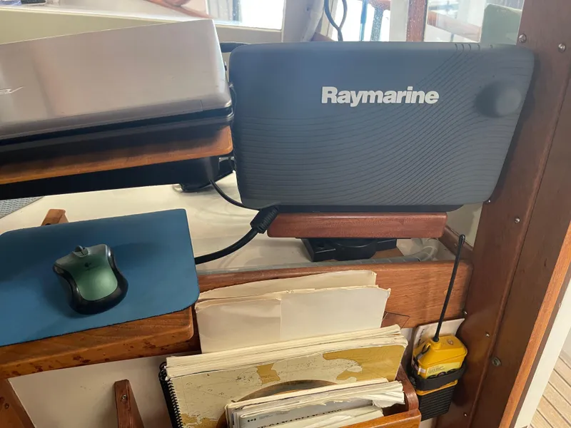 Slide: The Image of Navigation equipment on a 1969 Grand Banks 36 Classic boat, featuring Raymarine device and mouse. - 44